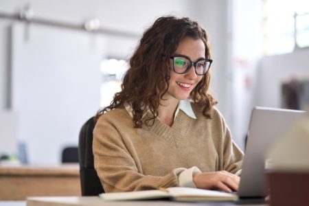 Young,Happy,Professional,Business,Woman,Worker,Employee,Sitting,At,Desk
